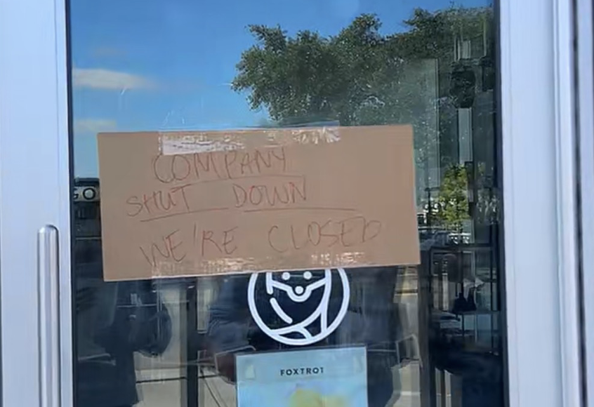 A piece of cardboard taped to the front door of Foxtrot in Snider Plaza. Signs like these were common after Foxtrot abruptly shut down its stores across the U.S.